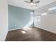 Bedroom with a ceiling fan, hardwood floors, and bright natural lighting at 816 Stannard Ct, Henderson, NV 89052