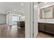 Hallway view with dark wood flooring, kitchen island, and bathroom at 816 Stannard Ct, Henderson, NV 89052