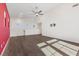 Bright living room featuring a ceiling fan, hardwood floors and a modern TV mount at 816 Stannard Ct, Henderson, NV 89052