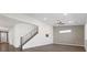 Open living area with stairs, hardwood floors, natural light, and contemporary ceiling fan at 816 Stannard Ct, Henderson, NV 89052