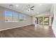 Bright living area with large windows, hardwood floors and sliding doors to outdoor space at 816 Stannard Ct, Henderson, NV 89052