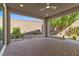 Comfortable covered patio with brick flooring and landscaped yard at 816 Stannard Ct, Henderson, NV 89052