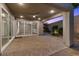Spacious covered patio with stone pavers and views of the landscaped backyard at 816 Stannard Ct, Henderson, NV 89052