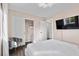 Bright bedroom features a closet with shelving and a wall-mounted television at 8353 Lower Trailhead Ave, Las Vegas, NV 89113