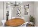 Charming dining area with a round table, modern chandelier, and ample natural light at 8353 Lower Trailhead Ave, Las Vegas, NV 89113