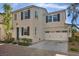 Charming two-story home featuring a brick driveway, attached two-car garage, and a well-manicured front yard at 8353 Lower Trailhead Ave, Las Vegas, NV 89113