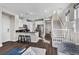 Well-lit kitchen with stainless steel appliances, white cabinetry, and dark countertops open to the living area at 8353 Lower Trailhead Ave, Las Vegas, NV 89113