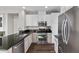 Modern kitchen showcasing stainless steel appliances, including a range and refrigerator, with granite countertops at 8353 Lower Trailhead Ave, Las Vegas, NV 89113