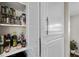 Organized pantry with spice rack and essentials, enhancing kitchen convenience and accessibility at 8353 Lower Trailhead Ave, Las Vegas, NV 89113