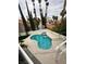 Aerial shot of the backyard, pool, patio, and lush landscaping at 8761 Rainbow Ridge Dr, Las Vegas, NV 89117