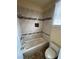 Tiled tub-shower combo featuring a tile accent stripe and built-in niche at 8761 Rainbow Ridge Dr, Las Vegas, NV 89117