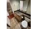 Bathroom features a glass bowl sink, marble counter, and wood cabinets at 8761 Rainbow Ridge Dr, Las Vegas, NV 89117