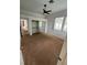 Bright bedroom with a ceiling fan, window views, and a mirrored closet, creating a comfortable space at 8761 Rainbow Ridge Dr, Las Vegas, NV 89117