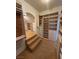 Spacious walk-in closet with built-in shelving and a unique architectural design, providing ample storage at 8761 Rainbow Ridge Dr, Las Vegas, NV 89117