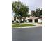 Classic two-story home boasting a circular driveway, mature trees, and a well-maintained front yard at 8761 Rainbow Ridge Dr, Las Vegas, NV 89117
