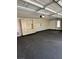 Attached two-car garage with built-in cabinets and lots of space for storage and organization at 8761 Rainbow Ridge Dr, Las Vegas, NV 89117