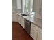 Bright kitchen features granite counters, modern appliances, and white cabinets, creating a clean and inviting space at 8761 Rainbow Ridge Dr, Las Vegas, NV 89117