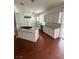 Spacious kitchen with white cabinets, stainless steel appliances, and a granite-topped island at 8761 Rainbow Ridge Dr, Las Vegas, NV 89117