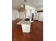 Modern kitchen with a center island, stainless steel appliances, and wood flooring at 8761 Rainbow Ridge Dr, Las Vegas, NV 89117