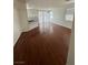 Dining and kitchen area with wood floors, stainless steel appliances, and access to outdoor area at 8761 Rainbow Ridge Dr, Las Vegas, NV 89117