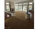 Spacious living room with a view of the pool and back yard through the large sliding glass doors at 8761 Rainbow Ridge Dr, Las Vegas, NV 89117