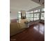 Bright living room features dark wood flooring, a fireplace, and many windows for lots of natural light at 8761 Rainbow Ridge Dr, Las Vegas, NV 89117