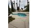 Beautiful backyard pool with a spa and manicured landscaping at 8761 Rainbow Ridge Dr, Las Vegas, NV 89117