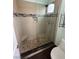 Modern bathroom shower with glass enclosure, mosaic tile accents, and contemporary fixtures for a spa-like feel at 8761 Rainbow Ridge Dr, Las Vegas, NV 89117