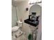 Unique bathroom with modern black sink and updated lighting above the round mirror at 901 Sulphur Springs Ln # 101, Las Vegas, NV 89128