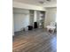 Bedroom featuring walk-in closet, built-in storage, and wood look flooring at 901 Sulphur Springs Ln # 101, Las Vegas, NV 89128
