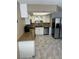 Updated kitchen with stainless steel appliances, stone counters, and tile floors at 901 Sulphur Springs Ln # 101, Las Vegas, NV 89128