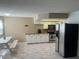 Bright kitchen with white cabinets, stainless steel appliances, and stone tile floors at 901 Sulphur Springs Ln # 101, Las Vegas, NV 89128