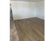 Living room showcasing vinyl wood flooring and neutral walls at 901 Sulphur Springs Ln # 101, Las Vegas, NV 89128