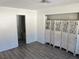 Spacious living room featuring vinyl flooring and a stylish folding screen at 901 Sulphur Springs Ln # 101, Las Vegas, NV 89128