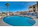 Community pool with lounge chairs and mature landscaping in a desirable neighborhood at 901 Sulphur Springs Ln # 101, Las Vegas, NV 89128