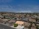 A beautiful aerial shot of the neighborhood with view of the Las Vegas Strip in the distance at 920 Serpentina Ave, Las Vegas, NV 89123