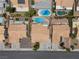 Overhead shot showcasing houses with swimming pools and lush landscaping in a well-maintained neighborhood at 920 Serpentina Ave, Las Vegas, NV 89123