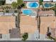 Aerial view showcases the private backyard with swimming pool and lush landscaping at 920 Serpentina Ave, Las Vegas, NV 89123