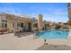 An eye-level view of the backyard pool and covered patio at 920 Serpentina Ave, Las Vegas, NV 89123