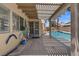View of the backyard patio leading to the swimming pool at 920 Serpentina Ave, Las Vegas, NV 89123