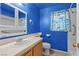 Charming bathroom with blue walls and a decorative shower curtain creates a relaxing space at 920 Serpentina Ave, Las Vegas, NV 89123