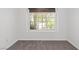 Bare bedroom with carpet and a bright window view at 920 Serpentina Ave, Las Vegas, NV 89123