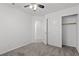 Bedroom including a closet with bifold doors, ceiling fan and an access door at 920 Serpentina Ave, Las Vegas, NV 89123