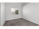 A carpeted bedroom with a window offering natural light and a cozy atmosphere at 920 Serpentina Ave, Las Vegas, NV 89123