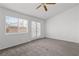 Bedroom with carpet, ceiling fan, and outdoor access through sliding glass door at 920 Serpentina Ave, Las Vegas, NV 89123