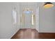 Bright foyer with hardwood floors, a decorative transom window and lots of natural light at 920 Serpentina Ave, Las Vegas, NV 89123