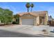 Beautiful home featuring an attached two-car garage and mature landscaping at 920 Serpentina Ave, Las Vegas, NV 89123