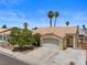 Inviting single-story house boasting a large driveway, desert landscaping and neutral color palette at 920 Serpentina Ave, Las Vegas, NV 89123
