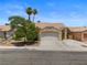 Charming single-story home featuring a well-manicured front yard and a spacious two-car garage at 920 Serpentina Ave, Las Vegas, NV 89123