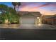 Charming single-story home with a well-maintained yard and attached two-car garage at 920 Serpentina Ave, Las Vegas, NV 89123